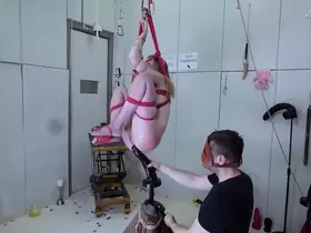 Anally impaled on massive didlo, caned, and covered in piss -- an extreme BDSM session with eager submissive masochist Rebel Rhyder