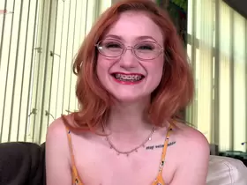 Watch the braces as redhead cute girl Scarlet Skies sucks dick!